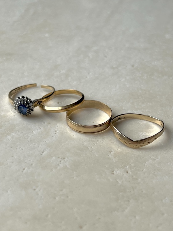 Before — four unworn gold rings